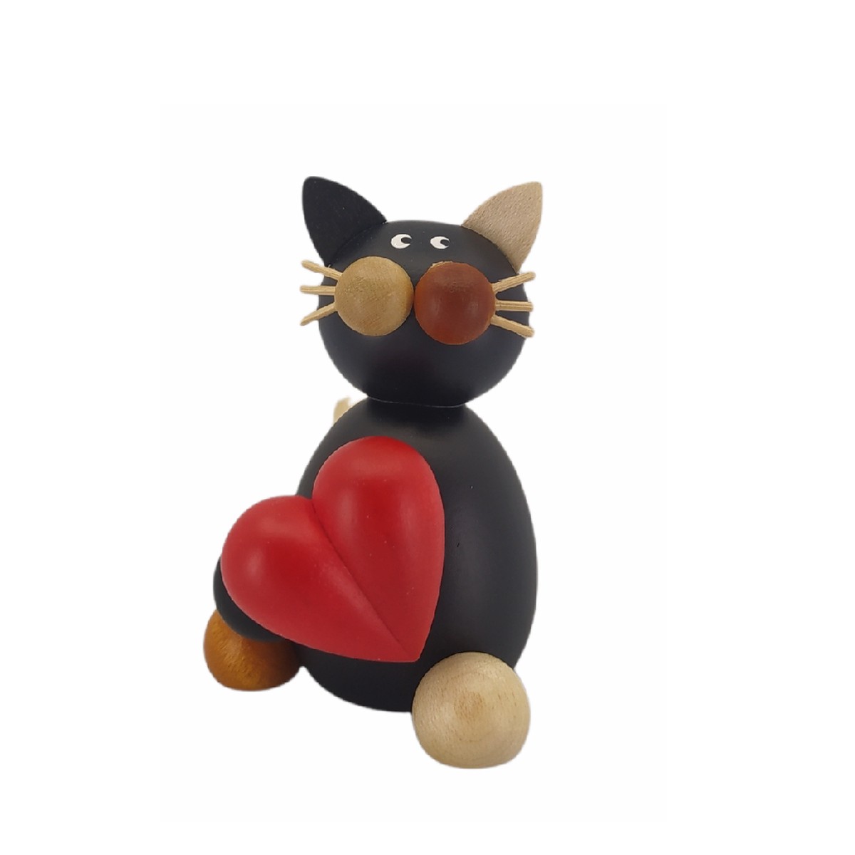 Calico cat Lela with a heart