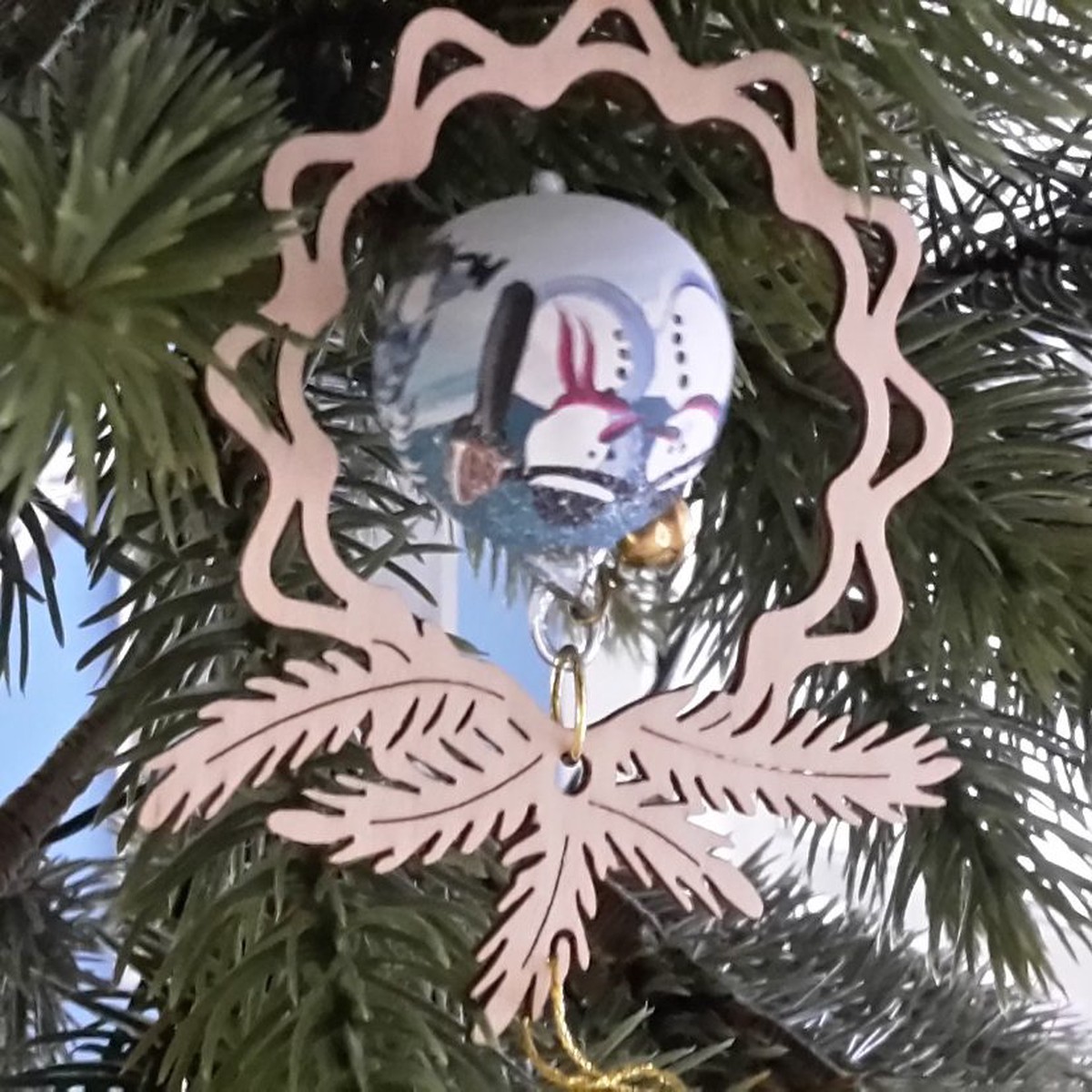 Tree decoration glass ball Snowman, in the branch